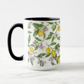 Lemon branches with blossoms and fruit on white tasse (Links)