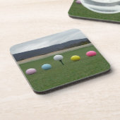 leuchtend farbige Golfbälle auf einem Berg Getränkeuntersetzer (Linke Seite)