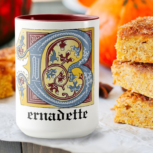 Leuchtender Buchstabe B des mittelalterlichen blau Tasse