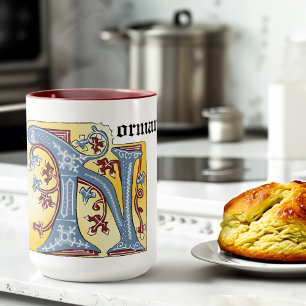 Leuchtender Buchstabe N des mittelalterlichen blau Tasse