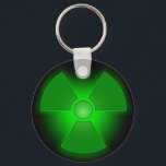 Leuchtendes grün leuchtendes Symbol für Radioaktiv Schlüsselanhänger<br><div class="desc">Dieses grüne Piktogramm ist das Symbol für Radioaktivität. Radioaktivität wird zur Stromerzeugung in Power-Pflanze verwendet. Strahlung ist für Mensch und Tier tödlich. Natürlich ist dieser Gegenstand nicht gefährlich... Es ist nur ein Witz.</div>