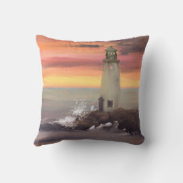 Leuchtturm an der Küste mit rosa und orangefarbene Kissen