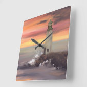 Leuchtturm an der Küste mit rosa und orangefarbene Quadratische Wanduhr (Winkel)