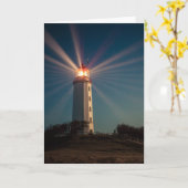 Leuchtturm auf einem Hügel, der nachts glänzt Karte (Gelbe Blume)