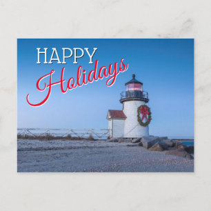Leuchtturm mit einem Weihnachtskranz Feiertagspostkarte