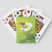 Libelle auf einer Blume, die Karten spielt Spielkarten (Rückseite)