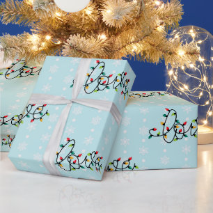 "Liebe" in Weihnachtslichtern, weiße Schneeflocken Geschenkpapier