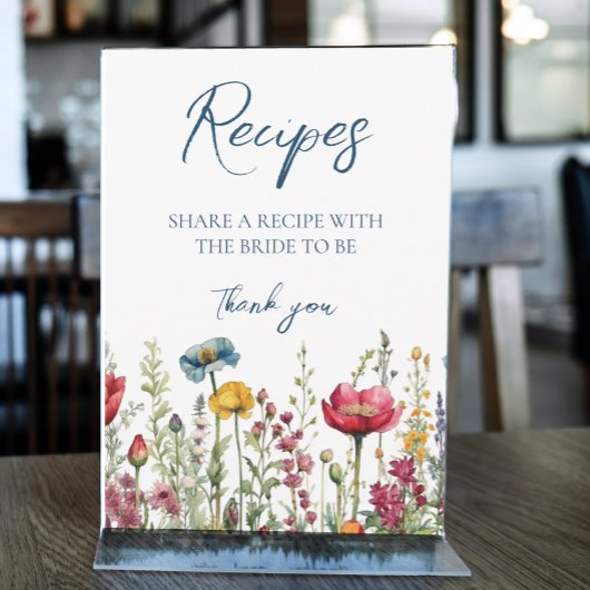 Liebe in Wildblumen mit blutfarbenem Wasser