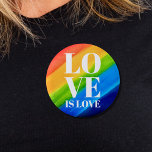 Liebe ist Liebe Pride Rainbow Button<br><div class="desc">Dieser Pride Button ist mit LIEBE IS LIEBE in fett-weißen Buchstaben auf einem wasserfarbenen Regenbogenhintergrund aus Rot,  Orange,  Gelb,  Grün,  Blau und lila dekoriert. Original Wasserfarbe © Michele Davies.</div>