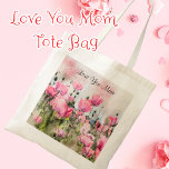 Liebe Sie Mama Aquarellfarbe Rosa Blume Malerei Tragetasche<br><div class="desc">Dieses Design verfügt über ein Aquarellbild von rosa Mohnblumen Blume in einem Feld mit den Worten Liebe You Mama. Sie können die Nachricht personalisieren,  wenn Sie gewollt haben.</div>