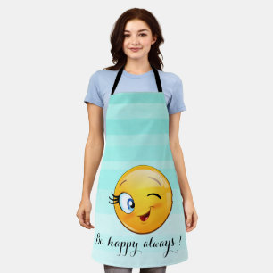 Liebenswürdiger zwinkerndes Emoji-Gesicht - Sei im Schürze
