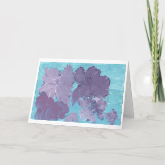 Lila Blumen auf blauem Hintergrund Karte