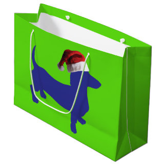 Lila Dackel mit einem Weihnachtshut Große Geschenktüte