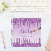 Lila Glitzer-Tropfen im Sketchbuch Notizblock