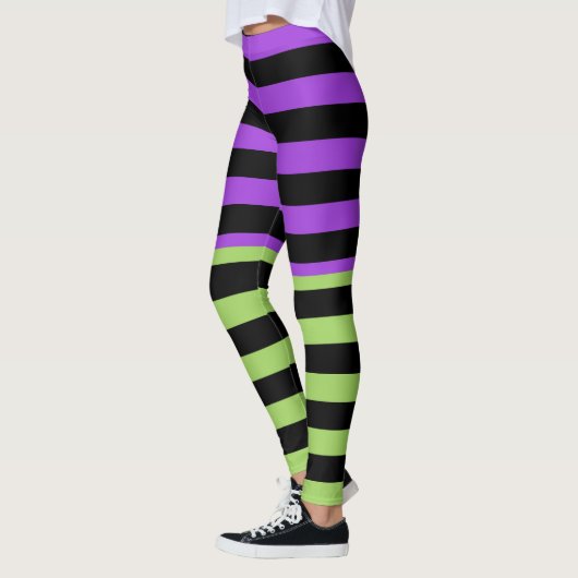 Lila- und schwarzer Halloween-Streifen Leggings (Links)