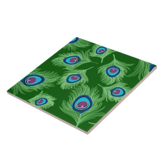 Limone und blaue Pfauenfedern auf Smaragdgrün Fliese (Seite)