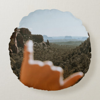 Links menschliche Hand Rundes Kissen