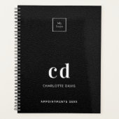 Logopartikel aus schwarzem Leder, Monogramm, Busin Planer (Vorderseite)