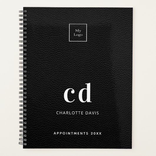 Logopartikel aus schwarzem Leder, Monogramm, Busin Planer (Vorderseite)