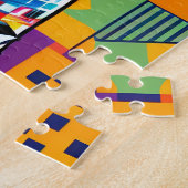 Löwe auf einem farbigen geometrischen Hintergrund Puzzle (Seite)