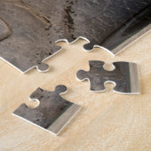 Löwenstatue vor historischer Kirche Puzzle (Seite)