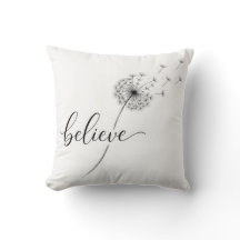 Löwenzahnkeimlinge mit dem Text 'Glaube'