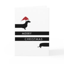 Lustige Dackel mit Weihnachtsmannmütze-glücklichen