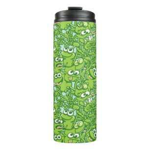 Lustige grüne Frösche verwickelt in einem Thermosbecher