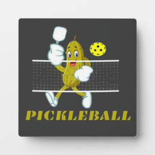 Lustige Gurke spielt Pickleball Fotoplatte