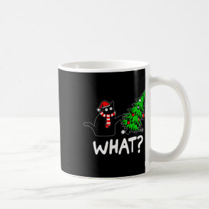 Lustige unartige schwarze Katze stößt Weihnachtsba Kaffeetasse