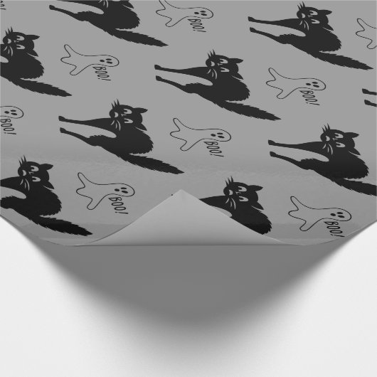 lustige verärgerte schwarze Katze und Geschenkpapier (Ecke)