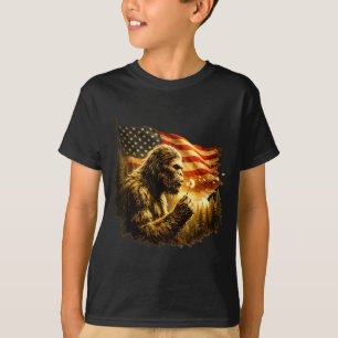 Lustiger Bigfoot bläst Löwenzahn mit der amerikani T-Shirt