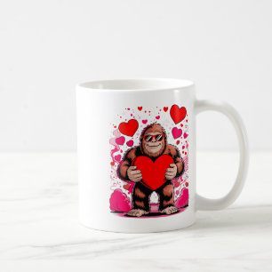 Lustiger Bigfoot mit Sonnenbrille hält Herz Valent Kaffeetasse