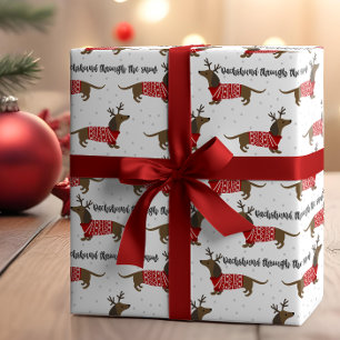 Lustiger Dachshund durch den Schnee Weihnachten Geschenkpapier