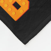 Lustiger Familien-Meister-Erbauer, der Bausteine u Fleecedecke (Ecke)