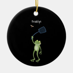 Lustiger grüner Frosch, der eine Fliege mit einer Keramik Ornament