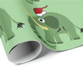 Lustiger grüner Weihnachtselefant in der Geschenkpapier (Rolleneckpunkt)