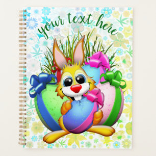 Lustiger Hase, der ein Osterei beißt Planer