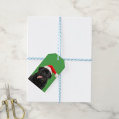 Lustiger schwarzer Mops mit Weihnachtsmannmütze un Geschenkanhänger (Mit Garn)