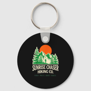 Lustiger Sonnenaufgang-Jäger beim Wandern auf eine Schlüsselanhänger