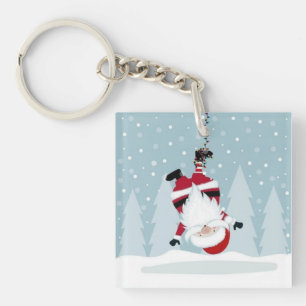 Lustiger Weihnachtsmann hängt kopfüber Schlüsselanhänger
