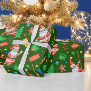 Lustiger Weihnachtsmann mit Geschenken Grün Geschenkpapier