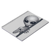 Lustiges graues Alien, das hinter UFO-Raum-Design Notizblock (Linke Seite)