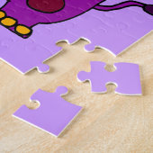 Lustiges lila Flusspferd, das Hula Band spielt Puzzle (Seite)