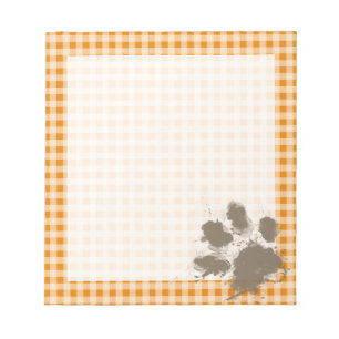 Lustiges Pawprint auf dunkelorangefarbigem Gingham Notizblock
