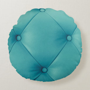 Luxuriöse, braune Ledermöbel, die jedoch mit einem Rundes Kissen