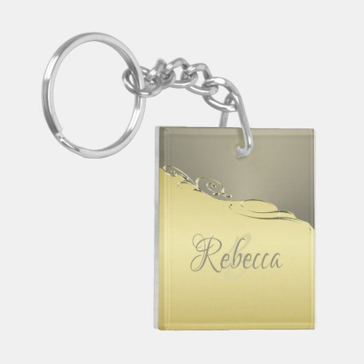 Luxuriöses goldenes Metall, das auf Gold und Silbe Schlüsselanhänger (Vorderseite links)