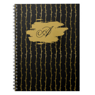 Luxuriöses schwarzes Notizbuch mit goldenem Blatt Notizblock