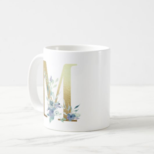 M, goldfarbener Erstling mit blauem Blumenblättern Kaffeetasse (Vorderseite Links)