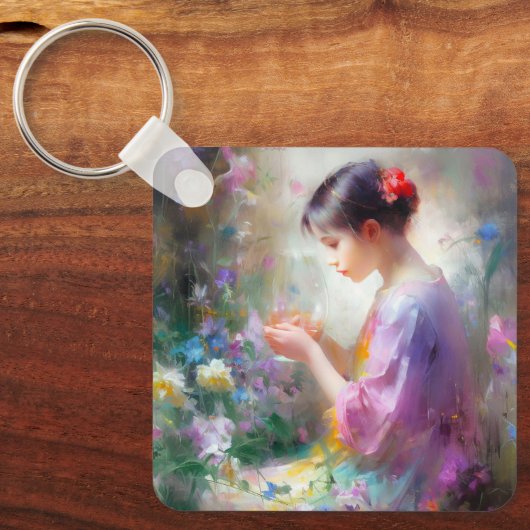 Mädchen bewundert eine Blume in ihren Händen Schlüsselanhänger (Vorderseite)